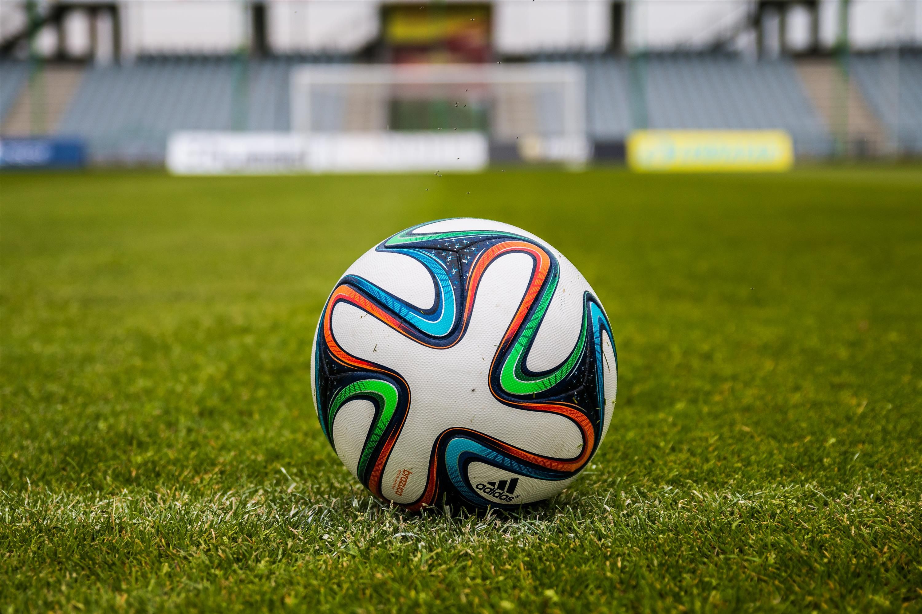 Match ball on a green football pitch